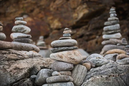 Smooth rocks stacked in a balanced formation.